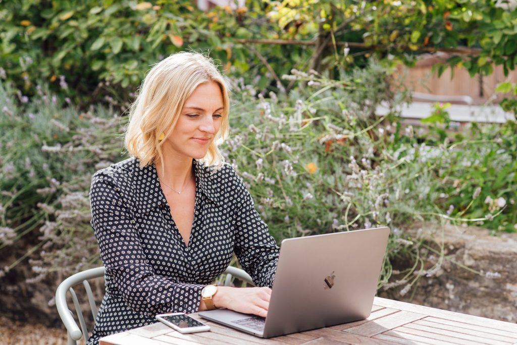 Woman sat at table on laptop