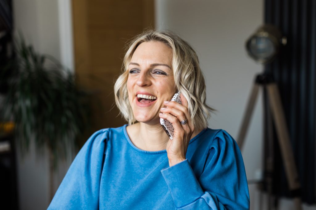 Kellie in blue on phone