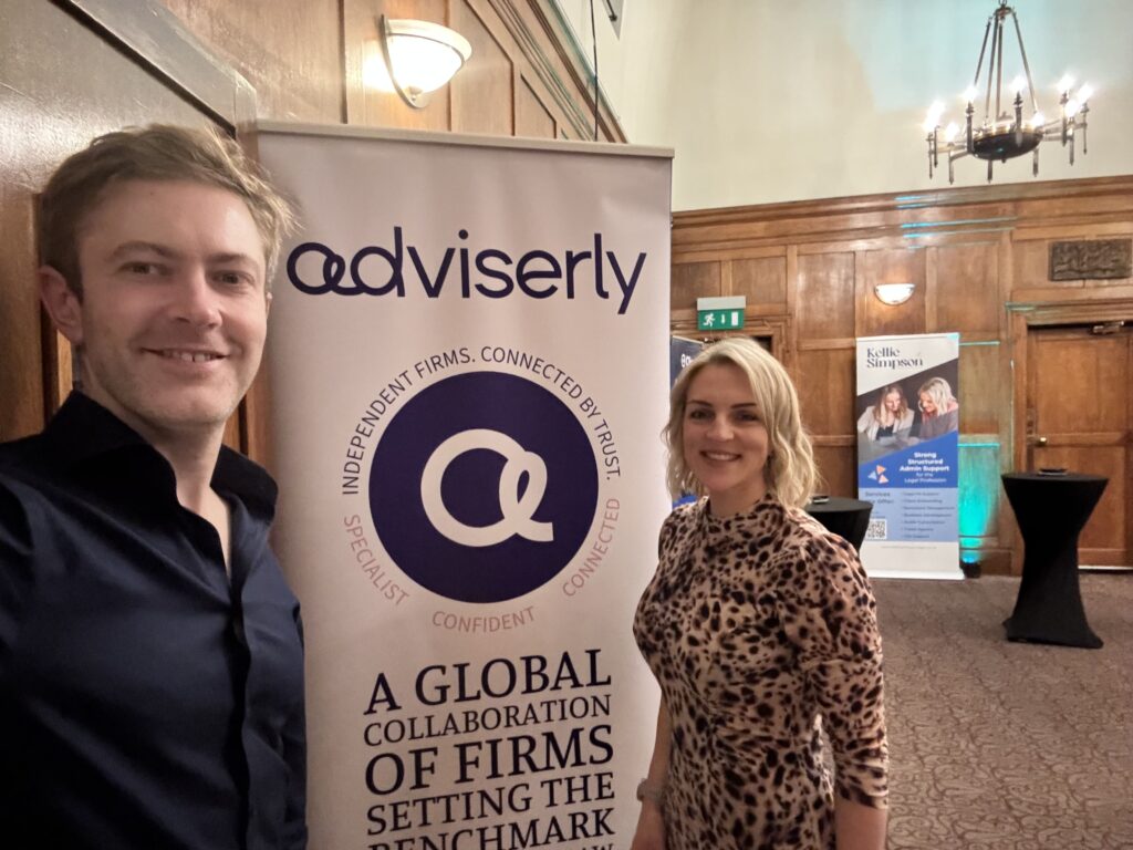 Kellie and Rob posing with the Advierserly banner 
