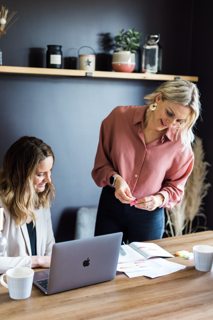 Kellie and friend collaboratively working on a project