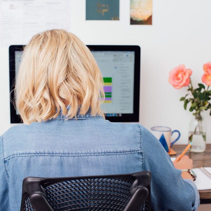 Virtual Assistant sitting at desk.