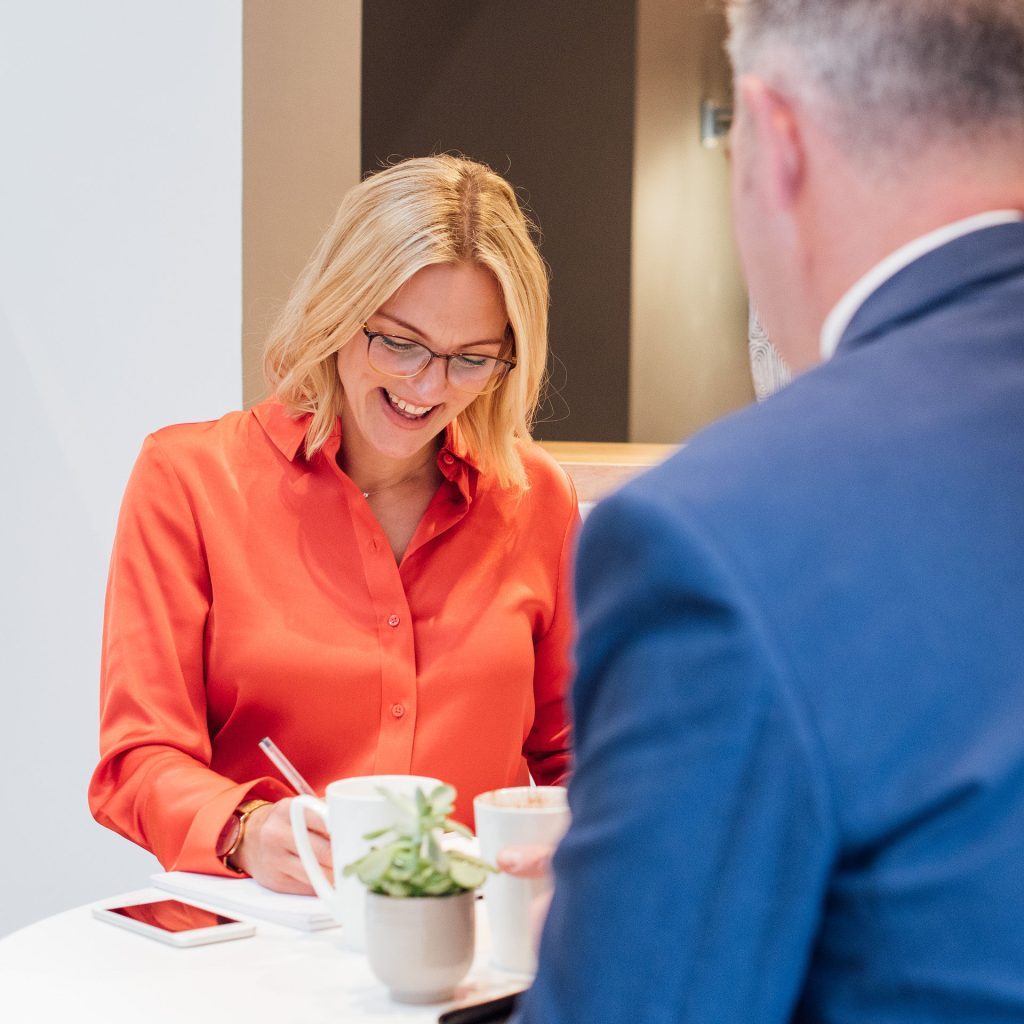 2 people in a meeting.