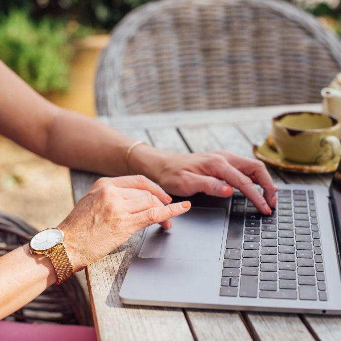 Woman on laptop setting goals