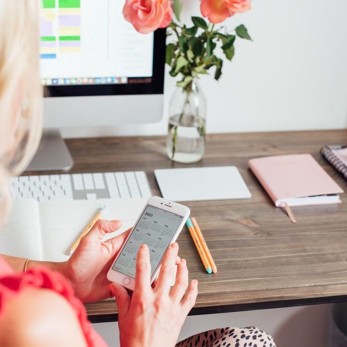 Lady on phone making arrangements.