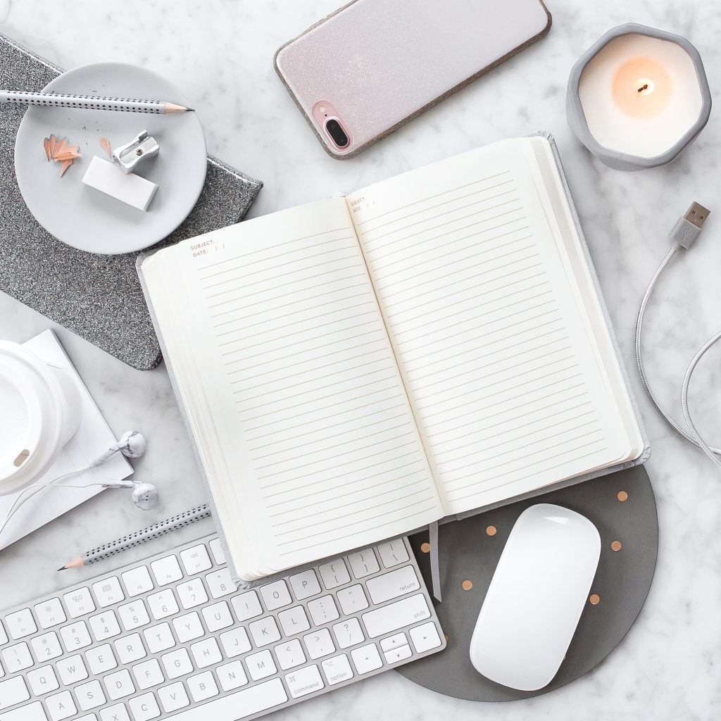 Grey note book and keyboard